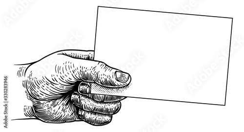 A hand holding business card or flyer frame message sign with copyspace