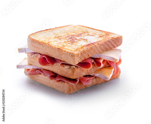Quadro em tela sandwich Doble de jamón serrano y queso camembert a la plancha sobre fondo blanco
