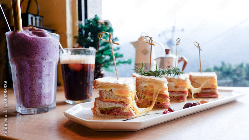Fototapeta premium Club sandwich with ham, tomato and cheese