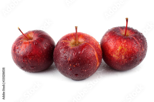 Three red little apples