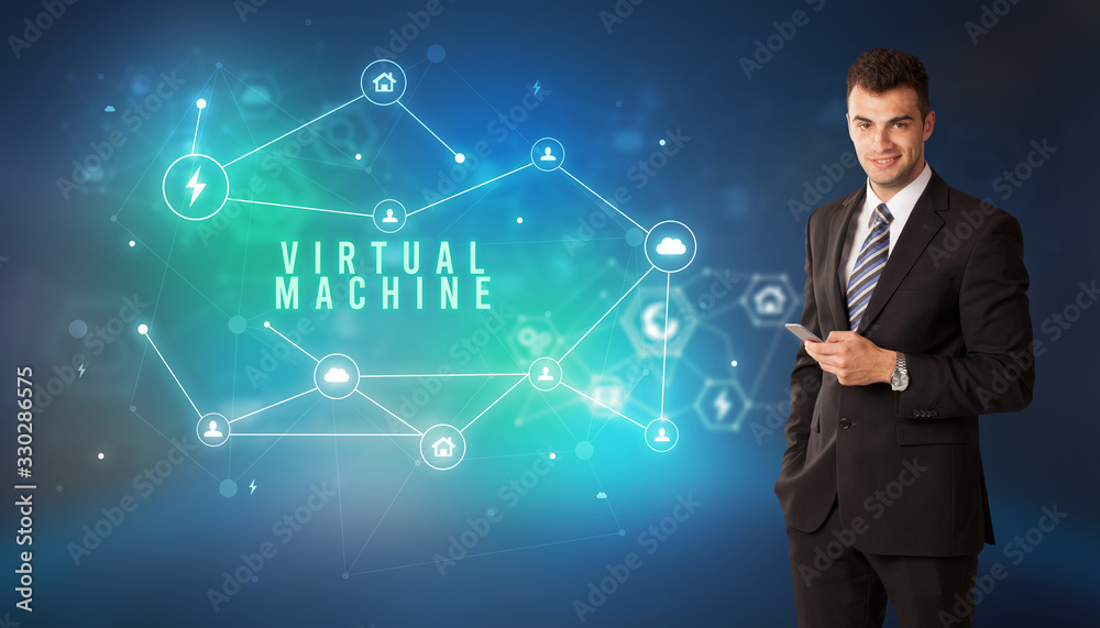 Businessman in front of cloud service icons with VIRTUAL MACHINE inscription, modern technology concept Businessman in front of cloud service icons with VIRTUAL MACHINE inscription, modern technology concept