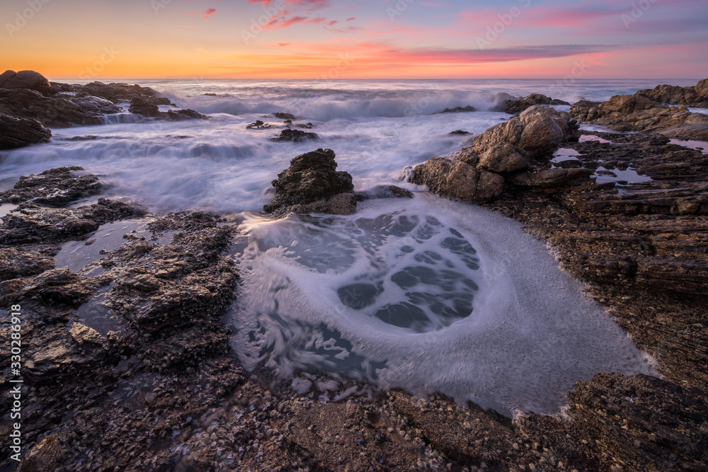 Obraz premium A beautiful seascape photographed just before sunrise on the Marina beach in South Africa.