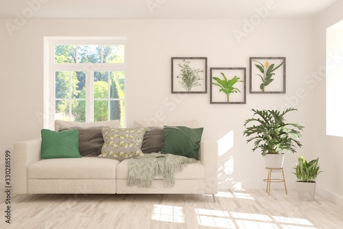 Minimalist living room in white color with sofa and summer landscape in window. Scandinavian interior design. 3D illustration