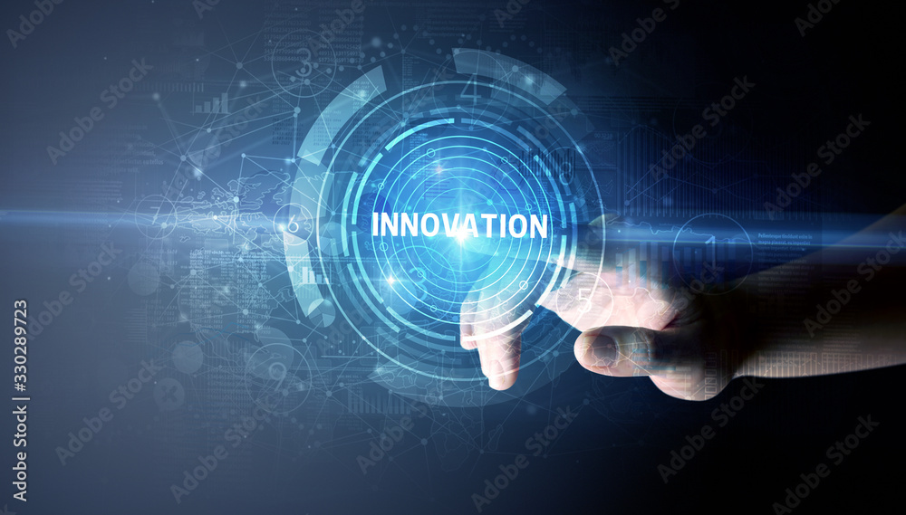 Hand touching INNOVATION button, modern business technology concept Hand touching INNOVATION button, modern business technology concept