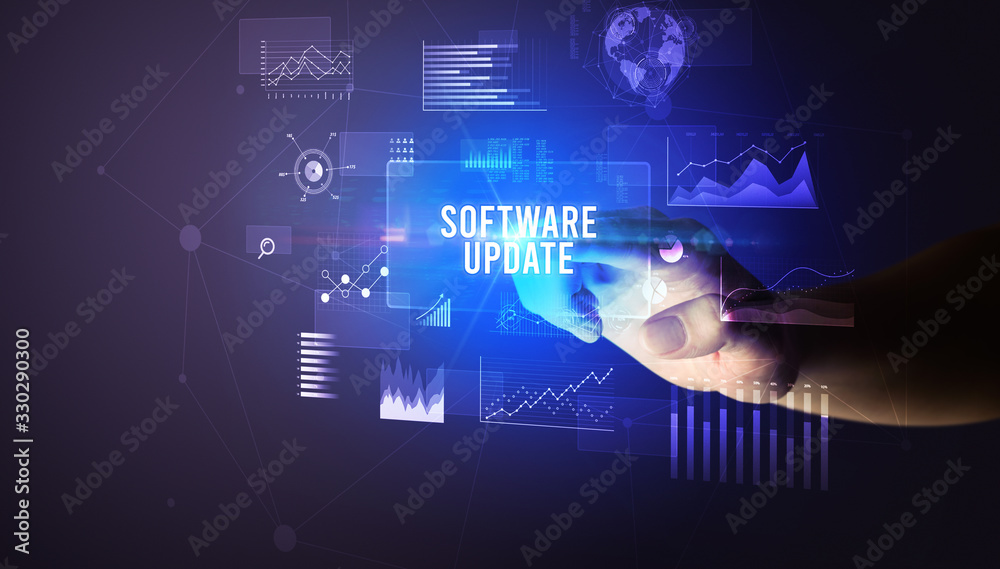 Hand touching SOFTWARE UPDATE inscription, new business technology concept Hand touching SOFTWARE UPDATE inscription, new business technology concept