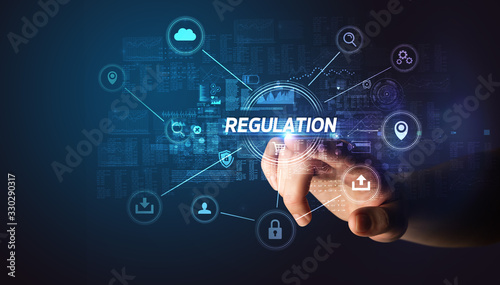 Billede på lærred Hand touching REGULATION inscription, Cybersecurity concept