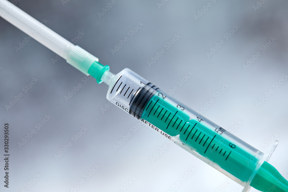 Close-up of medical syringe with drug Close-up of medical syringe with drug