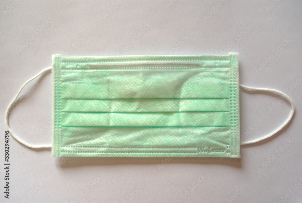 Green germ protection mask on a white background Green germ protection mask on a white background