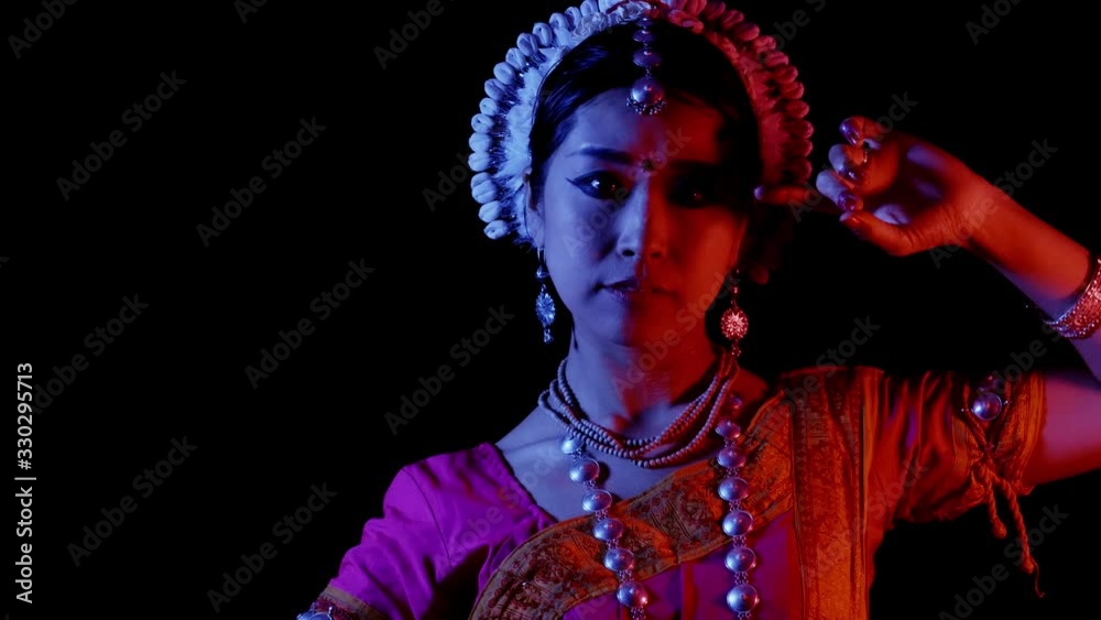 Odissi female asian dancer perform, Indian traditional, 4k studio shot