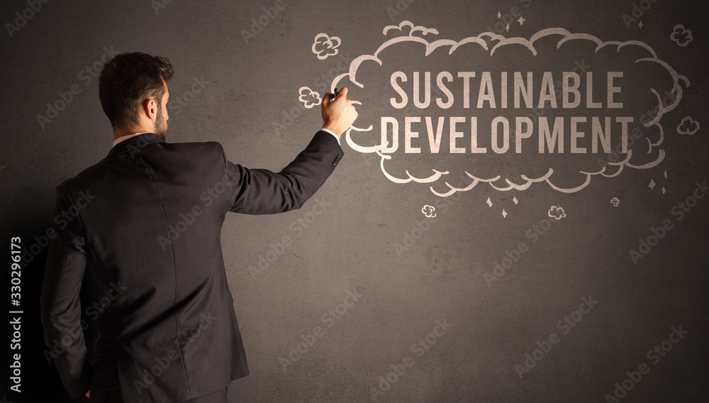 businessman drawing a cloud with SUSTAINABLE DEVELOPMENT inscription inside, modern business concept