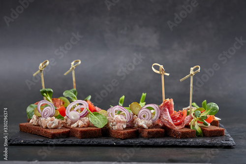 canape with meat  and vegetables photo