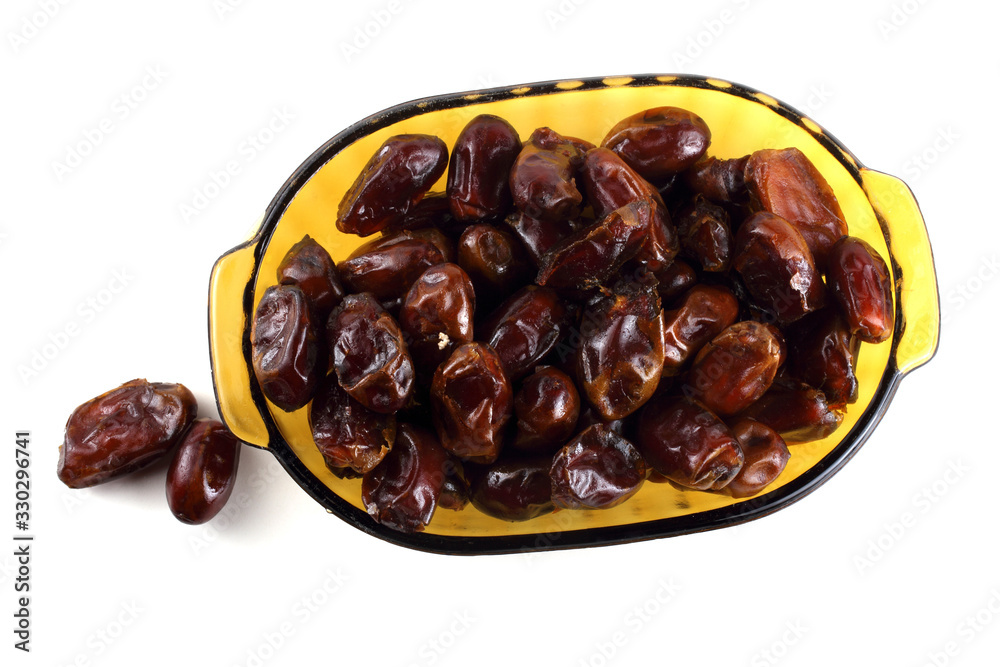 Date fruits on plate isolated on white Date fruits on plate isolated on white