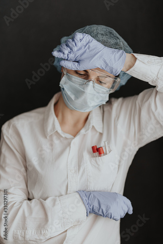 tired medical worker doctor after taking a large number of patients due to the epidemic of coronavirus