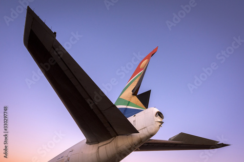A close up tail shot of a retired South African Airways boeing taken at sunrise in Johannesburg, South Africa.