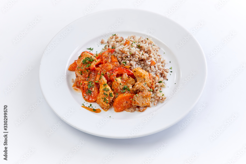 chicken with buckwheat on the white background chicken with buckwheat on the white background