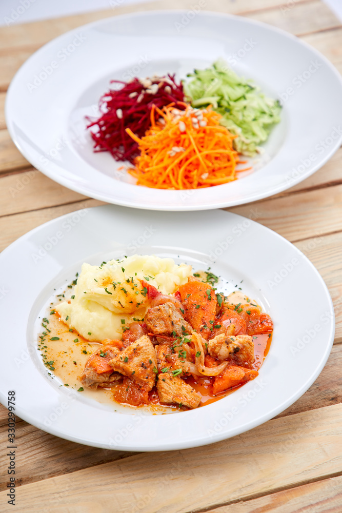 chicken with mashed potatoes and salad on the wooden background chicken with mashed potatoes and salad on the wooden background