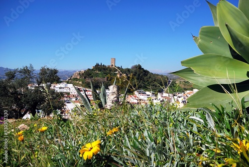 View over the town rooftops towards the Moorish castle, Velez Malaga, Spain. photo