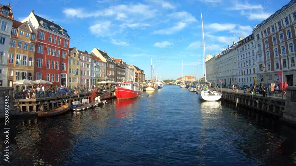 Time-lapse of Nyhavn Habor During a Beautiful Evening in Copenhagen Denmark On a Sunny Blue Sky Summer Evening Time-lapse of Nyhavn Habor During a Beautiful Evening in Copenhagen Denmark On a Sunny Blue Sky Summer Evening