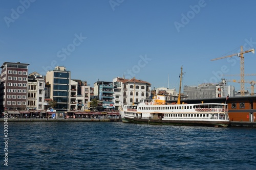 Pleasure boat at the pier of the Karakay city lines in the Bosphorus. Istanbul