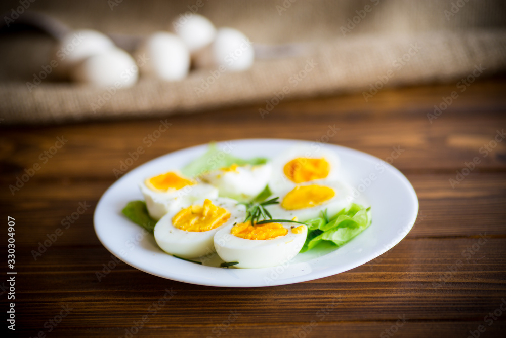 boiled eggs with salad leaves in a plate boiled eggs with salad leaves in a plate