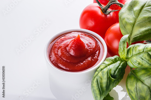 fresh natural tomato ketchup on a white background