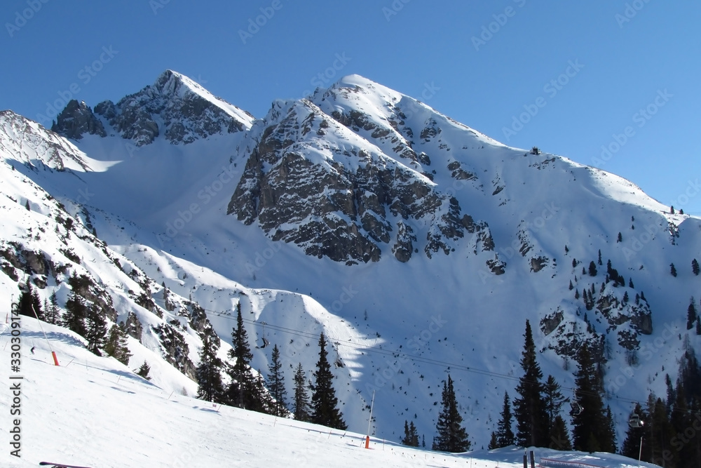 Triple peak under a snow blanket. Alps Austria Triple peak under a snow blanket. Alps Austria