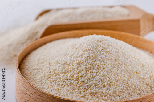 natural organic semolina on white acrylic background