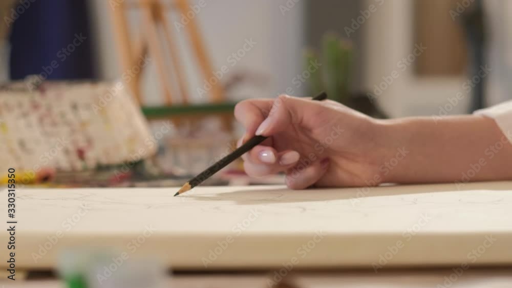 Drawing hobby. Creative leisure. Female artist hand sketching pencil on canvas.