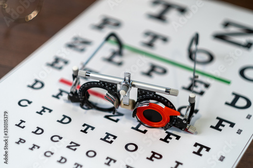 Closeup of glasses on eyevision test photo