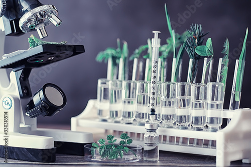 Microscope and test partings on the table in the laboratory.