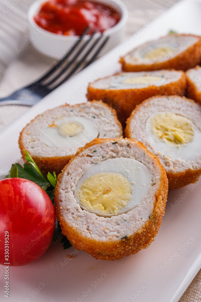 Scotch egg meat balls on rustic wooden background Scotch egg meat balls on rustic wooden background