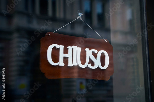 Italian sign "Chiuso" (Closed) of the bar.