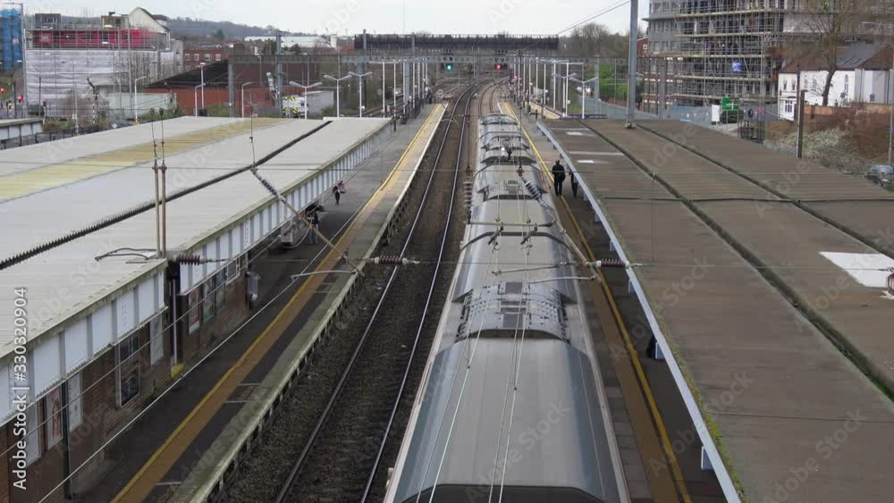 4K. Elevated view of Trains at Luton Station in exterior and cloudy day. Railway station in the Luton of London. Transport concept. Without pandemic. 4K. Elevated view of Trains at Luton Station in exterior and cloudy day. Railway station in the Luton of London. Transport concept. Without pandemic.