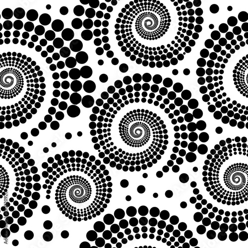 The seamless background is a monochrome spiral of circles. Vector illustration