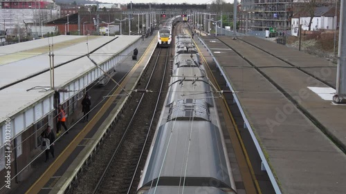 4K. Elevated view of Trains at Luton Station in exterior and cloudy day. Railway station in the Luton of London. Transport concept. Without pandemic.