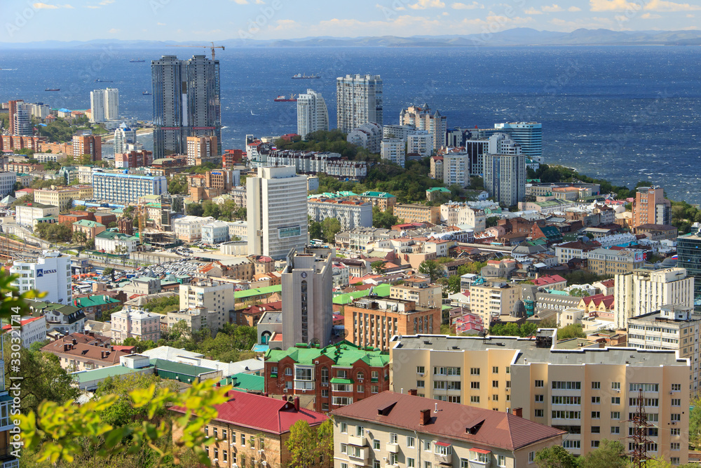Vladivostok, Russia, September, 18, 2019: Panorama of the central part of the city of Vladivostok from the top of the Eagle's Nest hill on a clear sunny day.