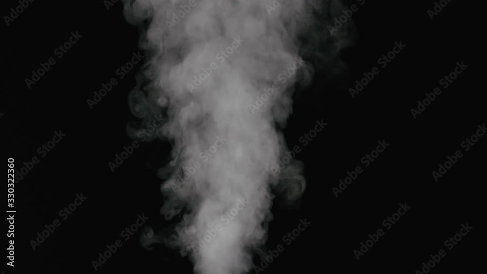 Slow motion water mist puff stream over black background