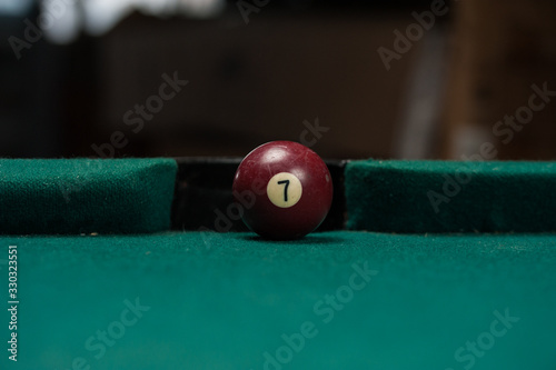 Billiards balls and cue on billiards table. Billiard sport concept