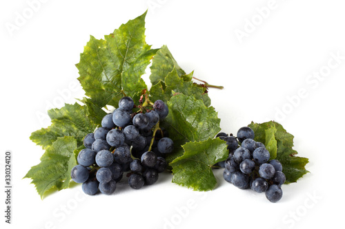 Wine grape and leaves isolated on white