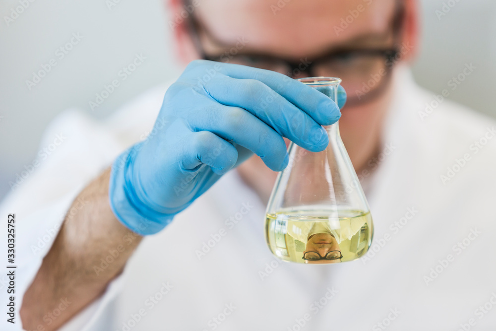 Chemist works with hemp CBDa oil in laboratory Chemist works with hemp CBDa oil in laboratory