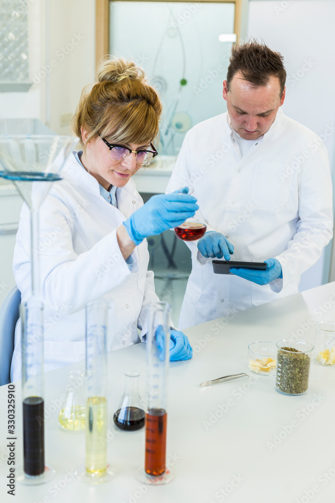 Chemist works with hemp CBDa oil in laboratory Chemist works with hemp CBDa oil in laboratory