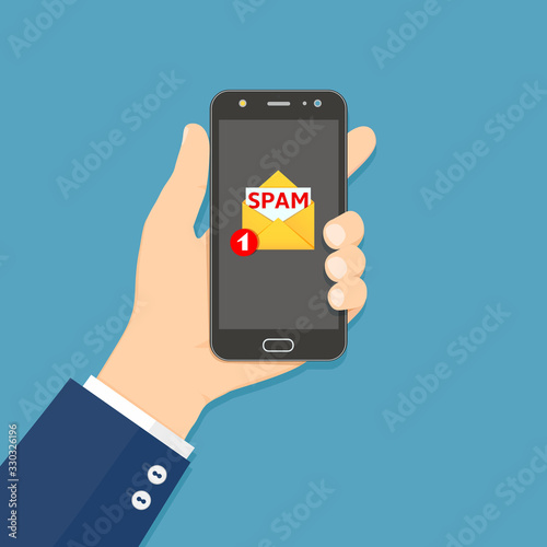 Hand holding smartphone with spam email on screen. Concept of spam email notification in mobile phone. Vector illustration in flat style. photo