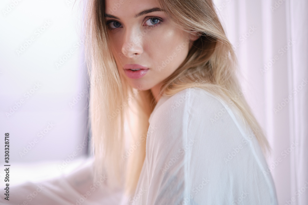 joyfully female with fair hair, dressed casually, looking with satisfaction at camera, being happy. Home shot of good-looking beautiful woman joyfully female with fair hair, dressed casually, looking with satisfaction at camera, being happy. Home shot of good-looking beautiful woman