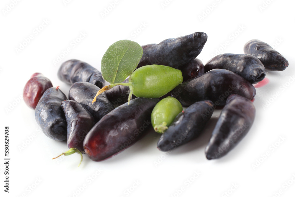 Honeyberry isolated on white. Ripe and unripe berries Honeyberry isolated on white. Ripe and unripe berries