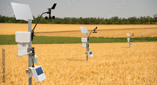 Weather station in a wheat field. Precision farming equipment photo
