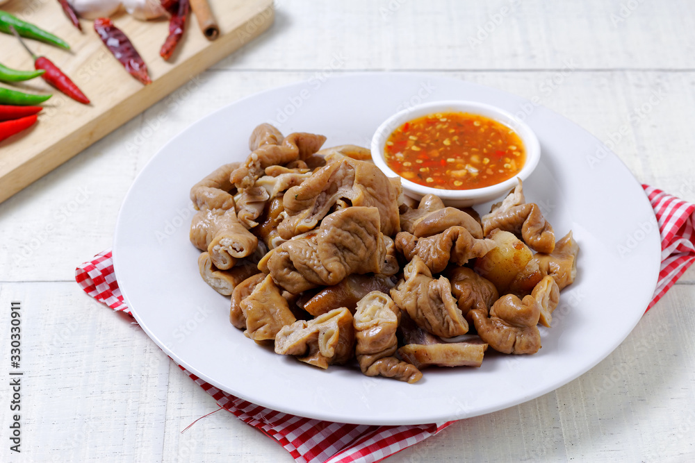 pork intestine stewed in the gravy with chilli sauce pork intestine stewed in the gravy with chilli sauce