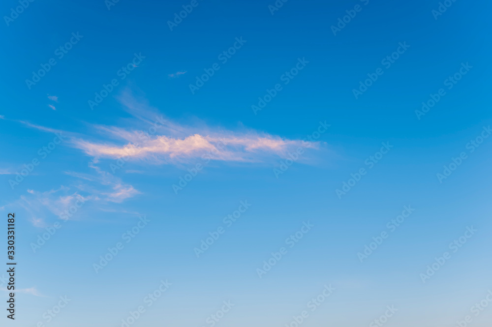 Blue sky background with tiny clouds Blue sky background with tiny clouds