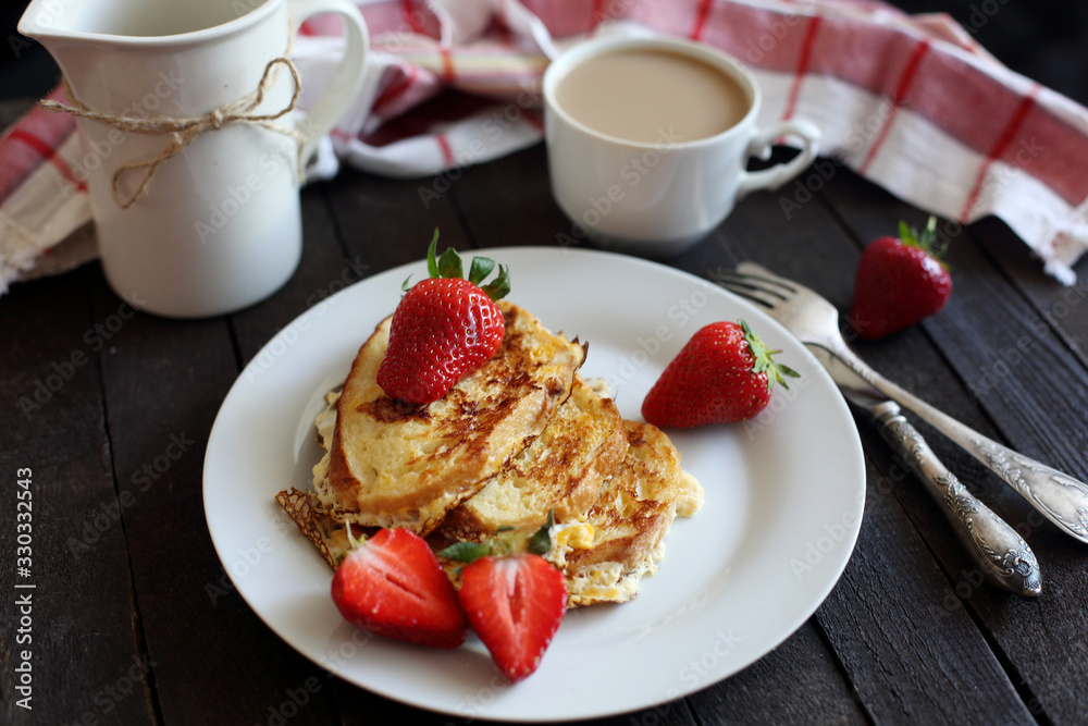 toast fried with egg with strawberries and coffee for Breakfast toast fried with egg with strawberries and coffee for Breakfast