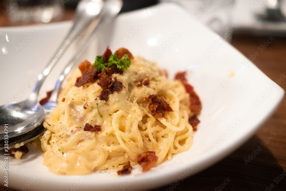 Spaghetti carbonara with bacon, ham and mayonnaise sauce Spaghetti carbonara with bacon, ham and mayonnaise sauce