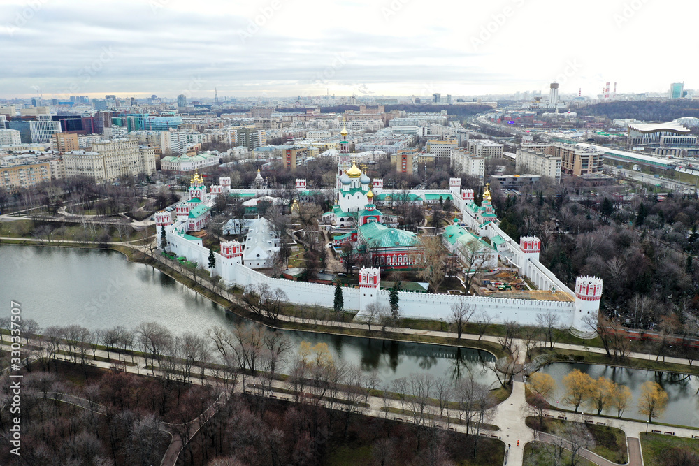 Fototapeta premium panoramic views of the lake, the fortress and the Christian temple of the big metropolis taken from the drone